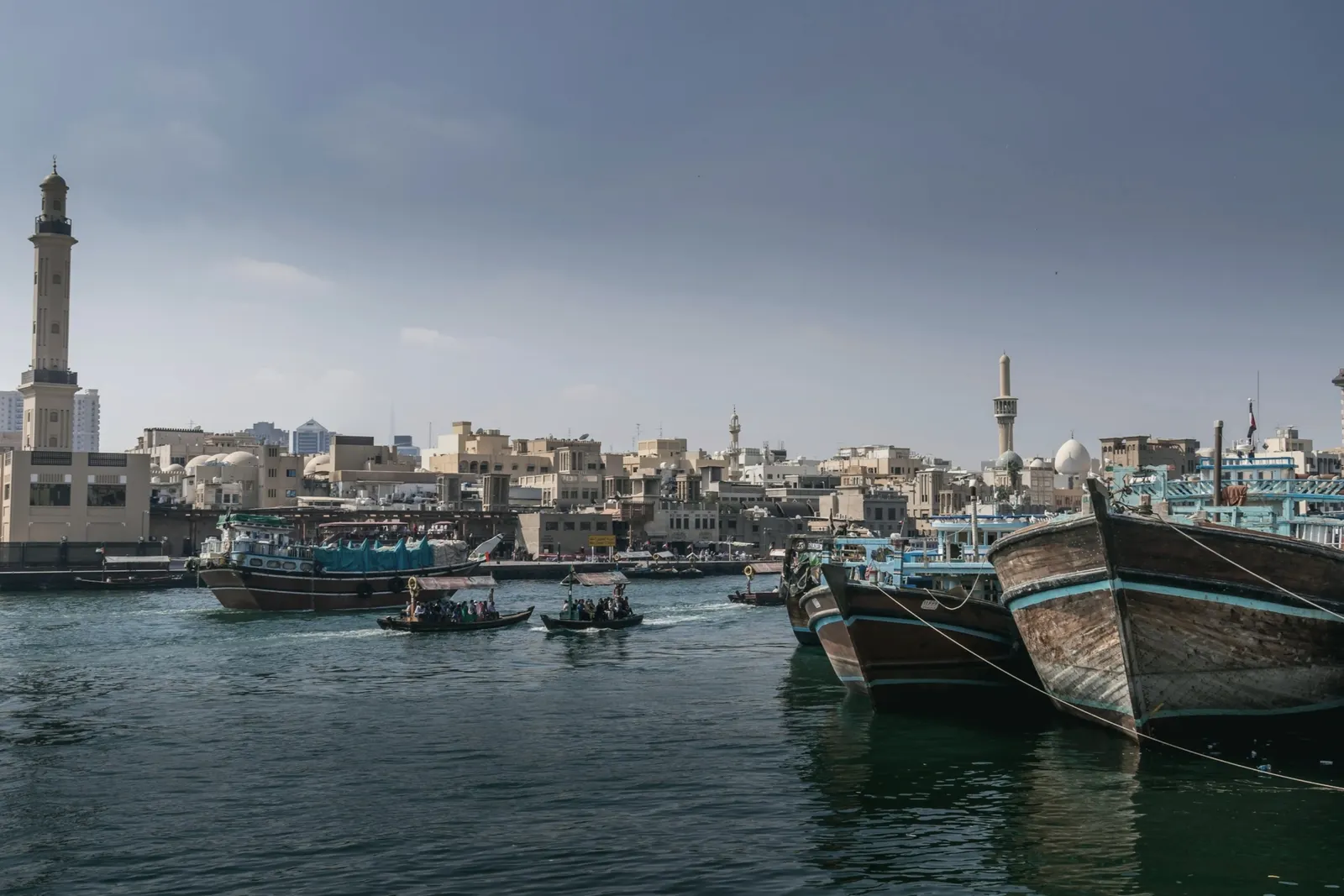 Dhows on Dubai Creek with the old city behind